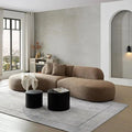 135.4-inch curved sectional sofa upholstered in boucle fabric, featuring a modern design with two matching pillows. Oversized chaise lounge seating for six in a stylish living room setting.
