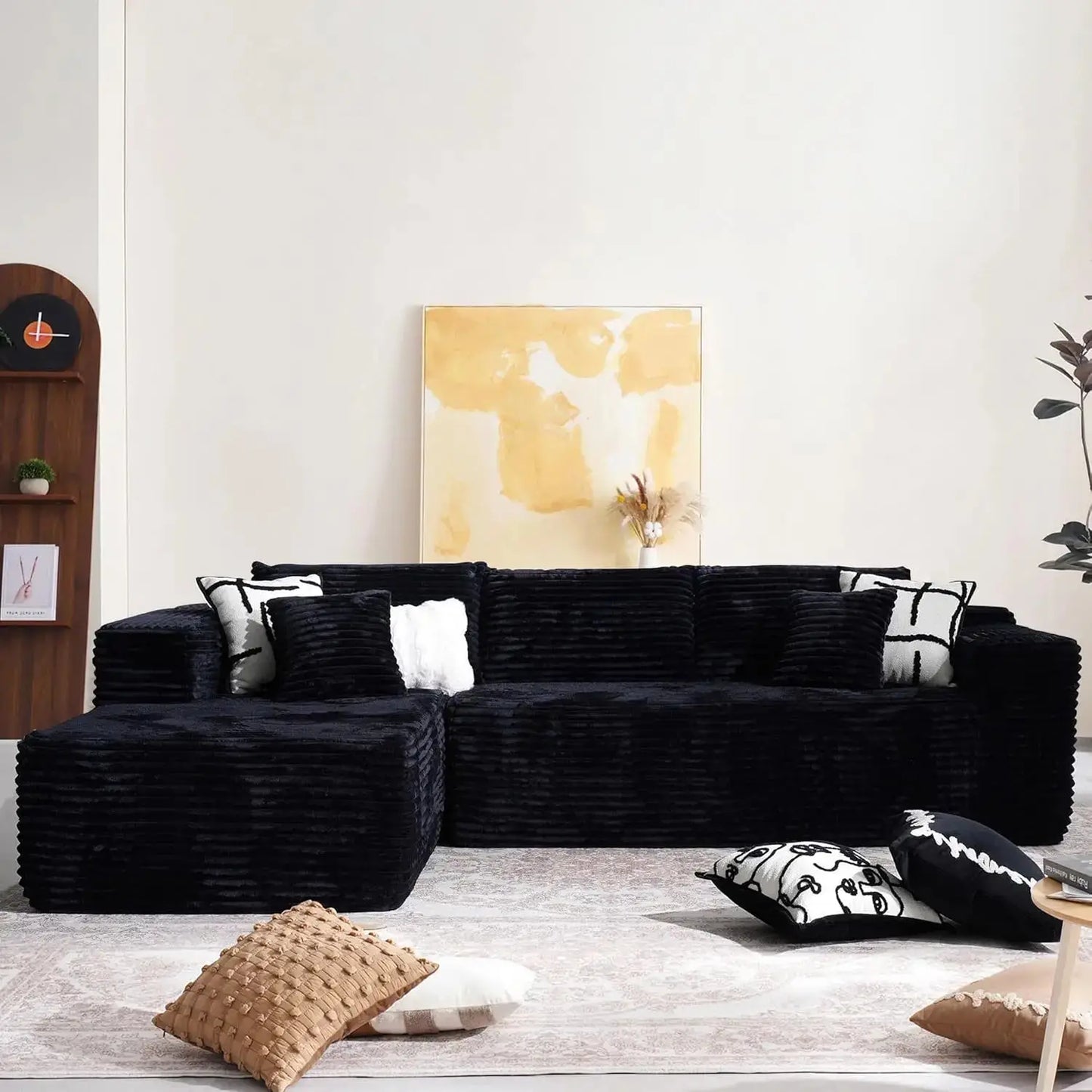 104-inch Cloud Sectional Couch with comfy chaise in a minimalist living room. Plush, boneless L-shape sofa with deep seating and modular design.