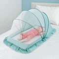 Foldable baby bed with mosquito net and cotton pillows, providing a safe and comfortable sleeping space for infants. Portable design for easy travel.