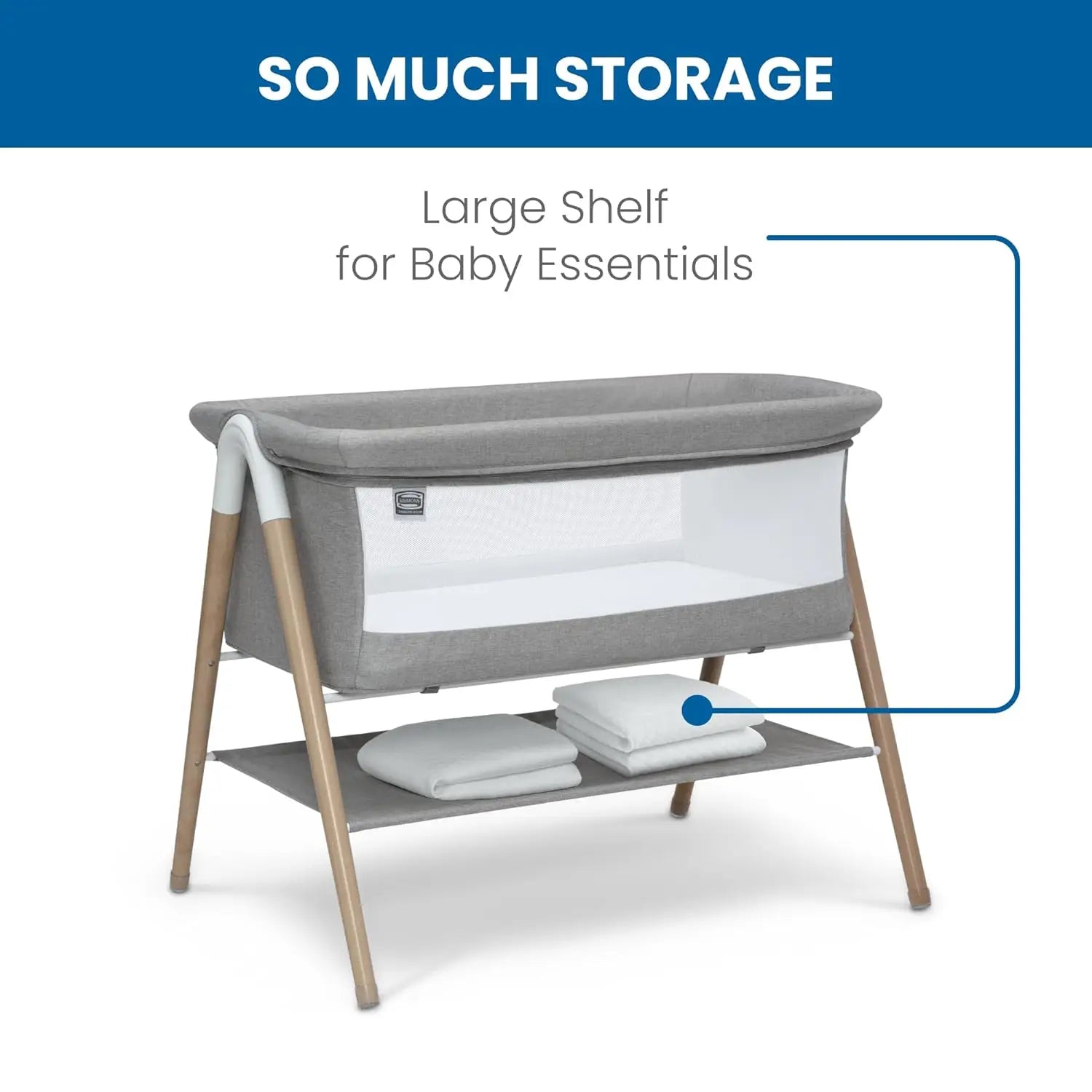 Koi by The Bed Bassinet with breathable mesh sides and natural beechwood legs in dove grey. Features a lower storage shelf, ideal for newborns and parents.