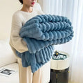 Light luxury solid color multifunctional rabbit velvet blanket in thick, warm flannel. Ideal for bedroom and living room use during winter.