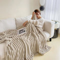 Light luxury solid color multifunctional rabbit velvet blanket in a thick, warm flannel design, perfect for bedroom or living room comfort.