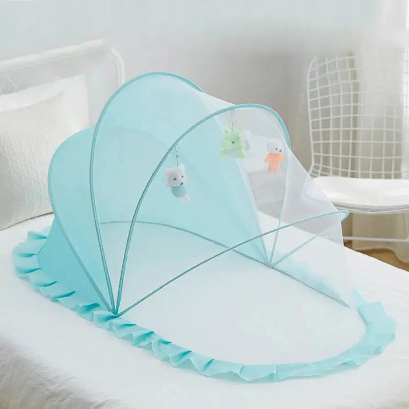 Foldable baby bed with mosquito net and cotton pillows, providing a safe and comfortable sleeping space for infants. Portable design for easy travel.