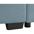 Velvet loveseat sofa with deep seating and storage ottoman in a modern living room. Plush upholstered design offers comfort and style.