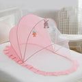 Foldable baby bed with mosquito net and cotton pillows, providing a safe and comfortable sleeping space for infants. Portable design for easy travel.