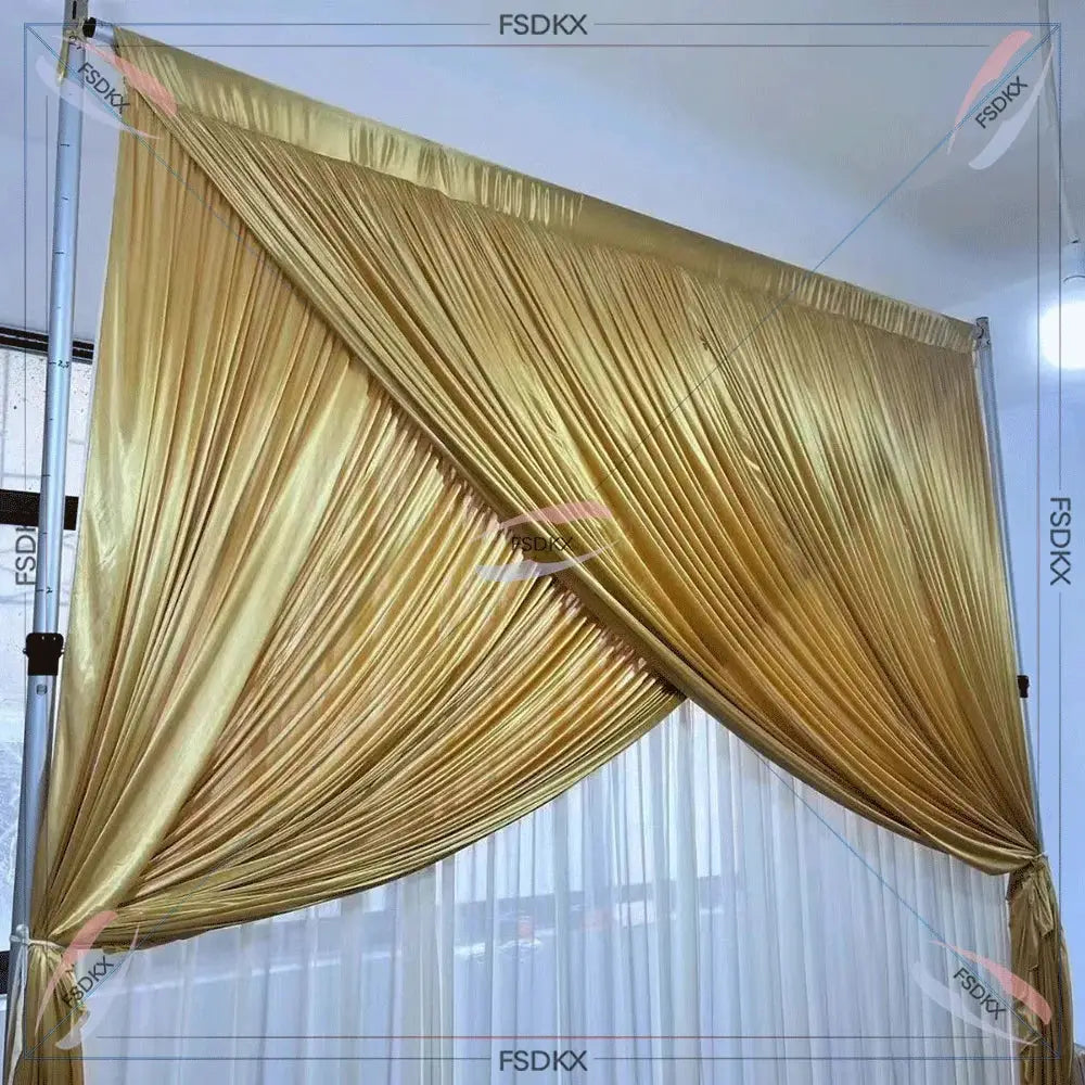 Elegant gold pleated stage backdrop curtain with a draped design, ideal for weddings, events, and theater productions. Luxurious fabric with a shimmering finish.