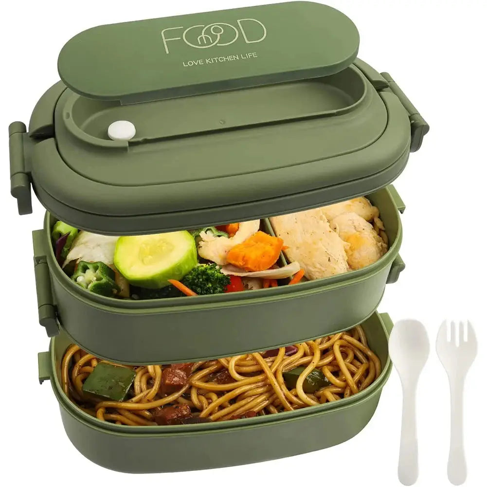 Green leakproof bento lunch box with cutlery set for kids and adults, placed on a kitchen counter. Durable, non-toxic, and safe for daily use.