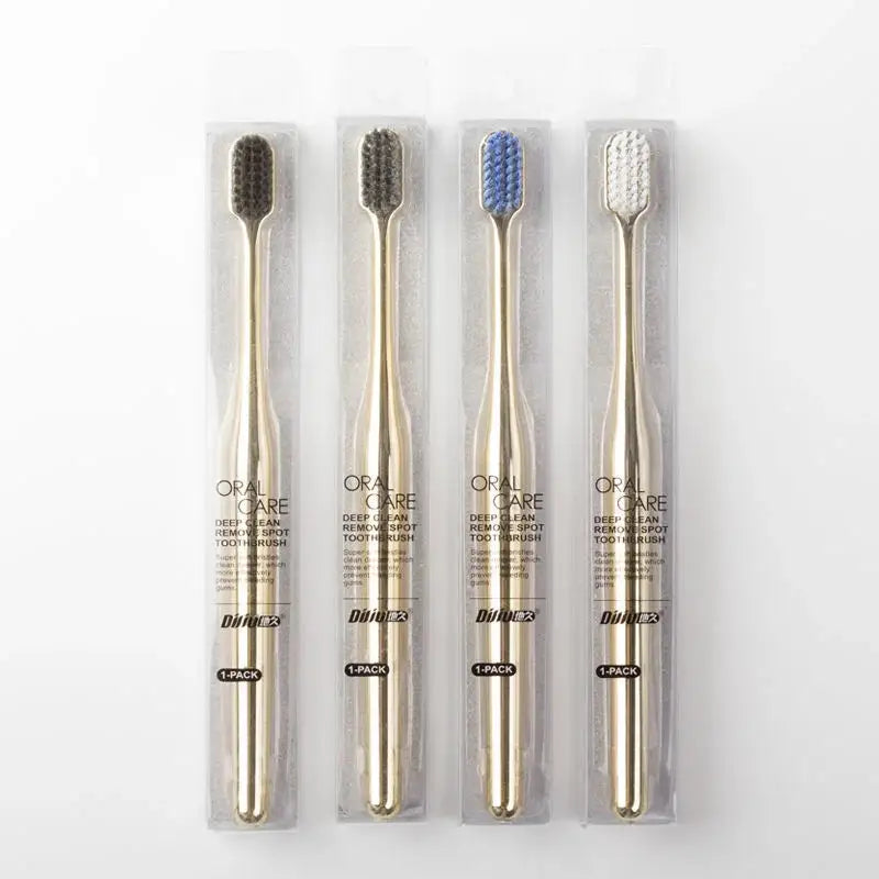 Packaged luxury gold toothbrushes with soft bristles in four colors. Wholesale customizable toothbrushes for men and women.