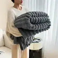 Light luxury solid color multifunctional rabbit velvet blanket in thick, warm flannel. Ideal for bedroom and living room use during winter.