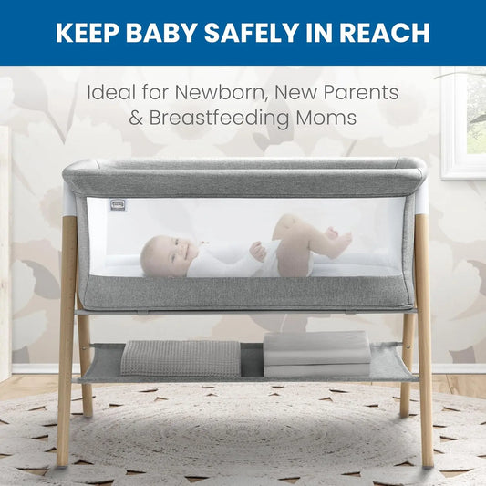 Koi by The Bed Bassinet with breathable mesh sides and natural beechwood legs in dove grey. Features a lower storage shelf, ideal for newborns and parents.