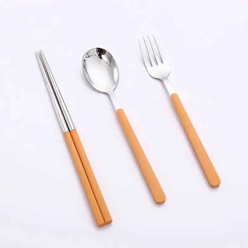 Stainless steel travel cutlery set in compact cases. Portable and reusable silverware with spoon, fork, and chopsticks, ideal for picnics or travel.