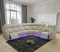 Leather reclining sectional sofa with power recliners, LED lighting, and built-in storage. Features wireless charging, reading lamps, and cup holders for ultimate comfort.
